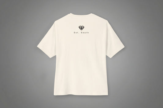 Beige t-shirt with a small logo and text on a grey background